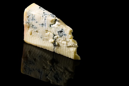a wedge of gorgonzola cheese